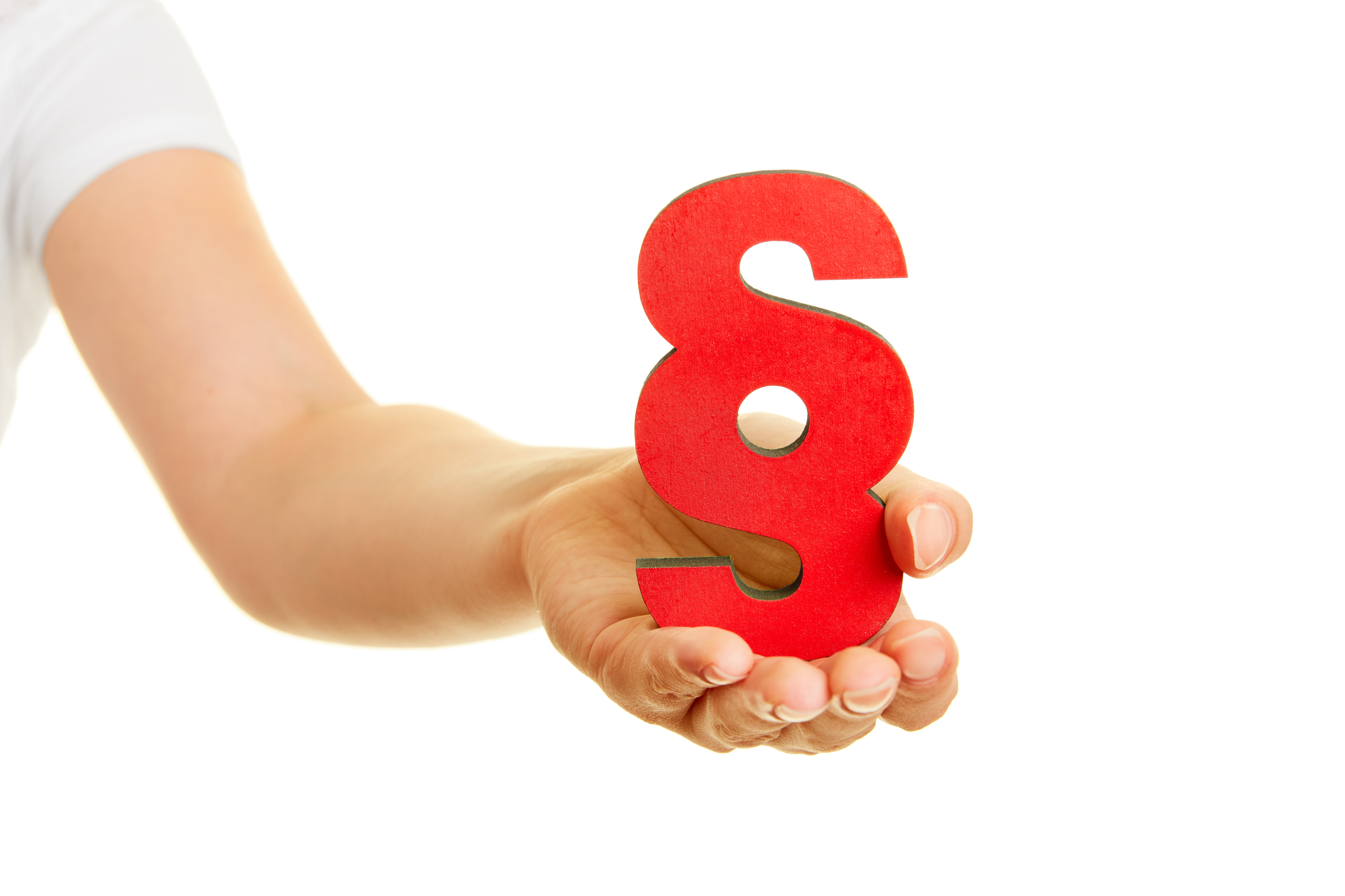 Hånd som holder rødt paragrafsymbol